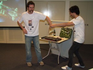 Paul carefully draws a raffle winner from the Golden Bag of Tickets