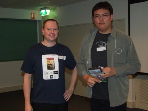 The game in Jetha's hand somewhat contradicts the game (logo) on his shirt.